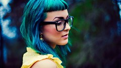 Woman glasses earrings blue hair green hair