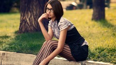 Woman glasses sitting outdoors brunettes models striped legwear