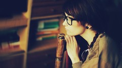 Woman glasses sitting thinking brunettes short hair