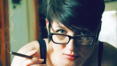 Woman glasses smoking short hair