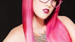 Woman glasses tattoos pink hair