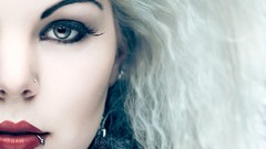 Woman green eyes piercings