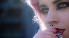 Woman green eyes piercings
