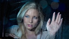 Woman hands water drops car windows