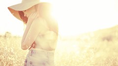 Woman hats fields sunlight