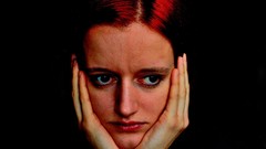 Woman head hands black background faces redheads