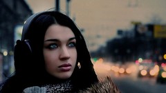 Woman headphones blue eyes black hair