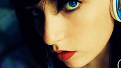 Woman headphones faces blue eyes
