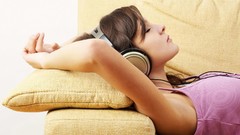 Woman headphones lying down