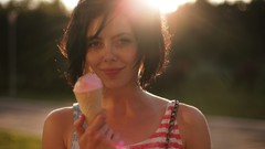 Woman ice cream American Flag earrings sunlight brunettes short 