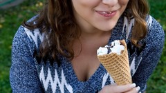 Woman ice cream Jumper faces sitting fences outdoors long hair 