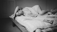 Woman interior monochrome closed eyes lying down