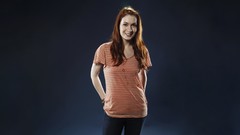 Woman jeans blue background Actress redhead smiling Felicia Day 