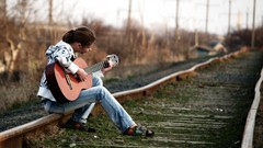 Woman jeans guitars brunettes railroad tracks
