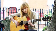 Woman jeans Jumper sitting guitars outdoors blondes long hair 