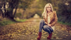 Woman jeans outdoors blondes crouched high heels crouch