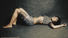 Woman jeans Shorts tattoos barefoot brunettes short hair lying 