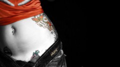 Woman jeans tattoos piercings