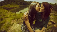 Woman lakes kissing lesbians