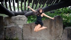 Woman lakes legs jumping models black dress takara