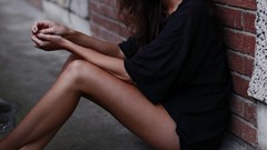 Woman legs brunettes brick wall