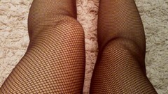 Woman legs fishnet stockings body parts