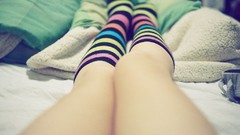 Woman legs lying down knee socks striped legwear body parts