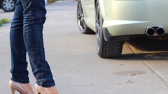 Woman legs pants high heels blue jeans
