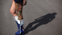 Woman legs tattoos boots