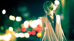 Woman lights dress blurred background