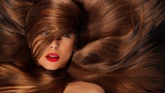 Woman lips brunettes hair in face