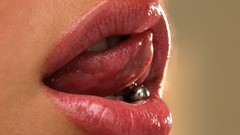 Woman lips tongue piercings