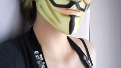 Woman masks Anonymous Guy Fawkes