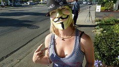 Woman masks Anonymous Guy Fawkes