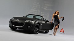Woman Mazda vehicles mazda mx 5 front angle view black and matte