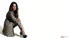 Woman Megan Fox models Simple Background