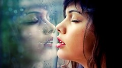 Woman mirrors models window