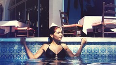 Woman models bikini swimming pools