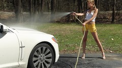 Woman models denim shorts Blu Angel hose (garden)