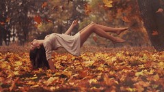 Woman models fallen leaves