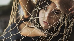 Woman models fishnet lingerie