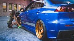 Woman models Mitsubishi Lancer Evolution