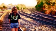 Woman models railroad tracks