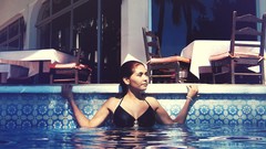 Woman models swimming pools