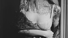 Woman monochrome blondes tattoos bra