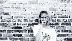 Woman monochrome brick wall Archigraph Reza farsipack