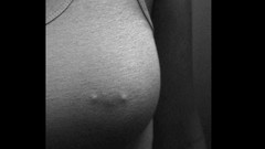 Woman monochrome nipples through clothing pierced nipples