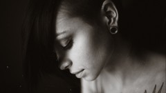 Woman monochrome tattoos piercings