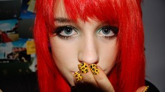 Woman nails faces redheads