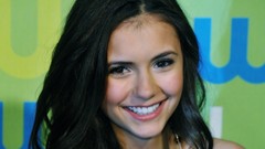 Woman Nina Dobrev faces smiling